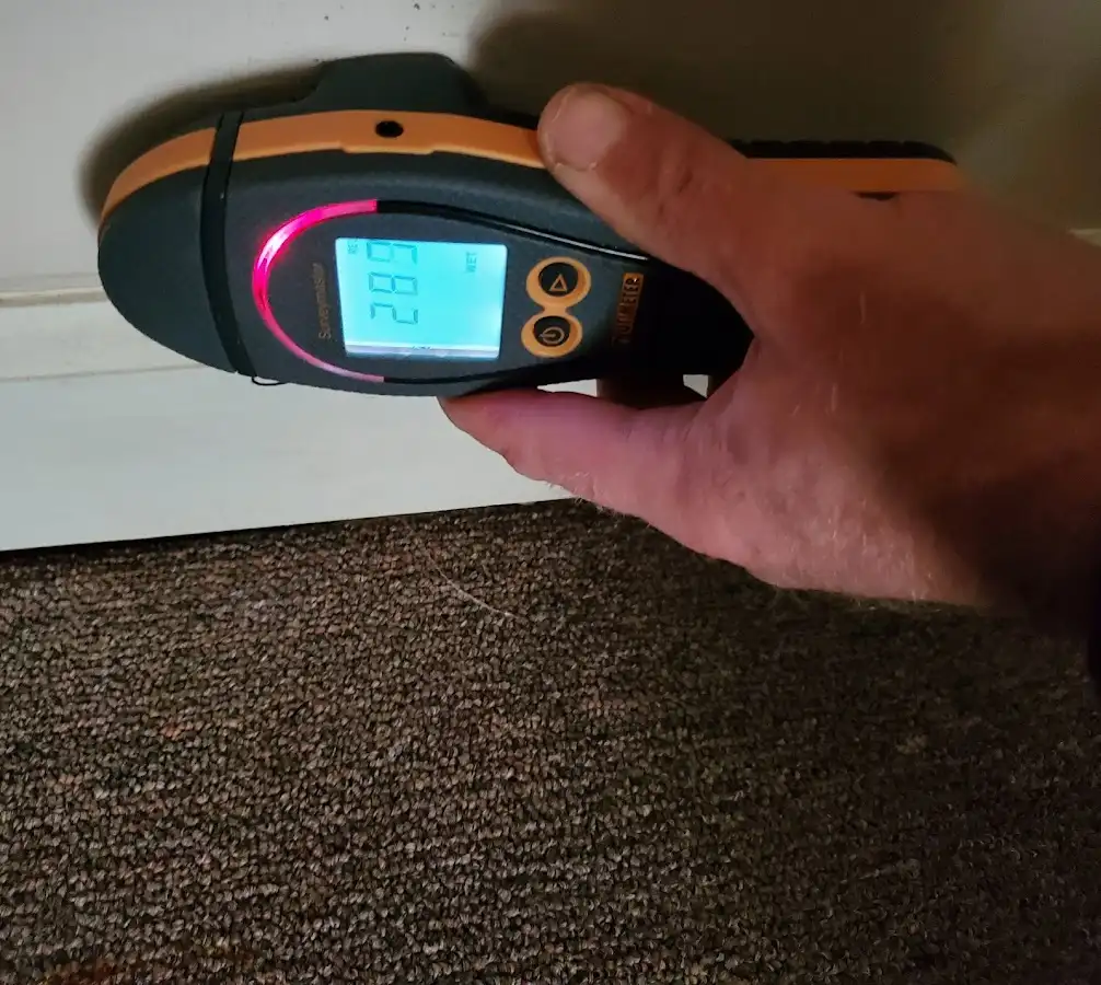 Moisture detection at baseboard during Burst Pipe Cleanup in Coto de Caza